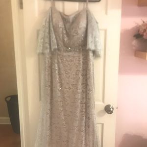 New jovani gown. Silver lace gown silver lace on top of a neutral beige skirt